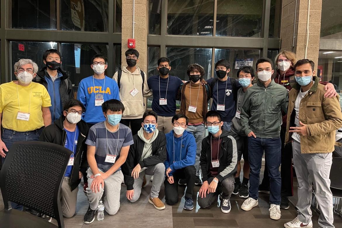 The UCLA regional teams masked up for a group photo in the awards room after the contest.